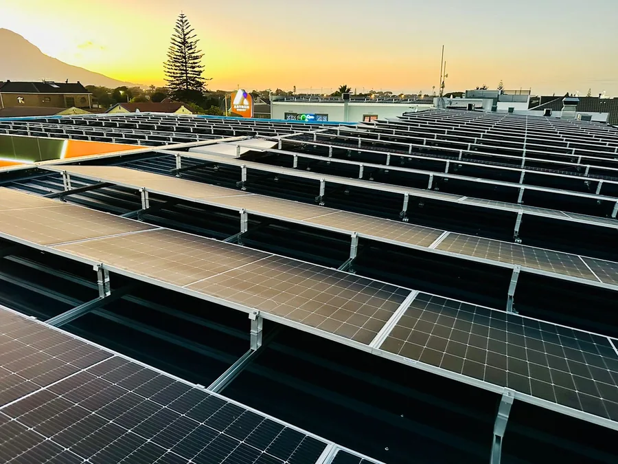 Large rooftop solar panel array installed on an Astron Energy commercial building in Cape Town